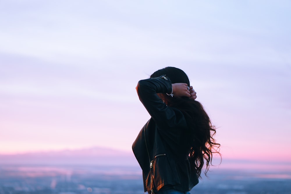 woman holding her hair