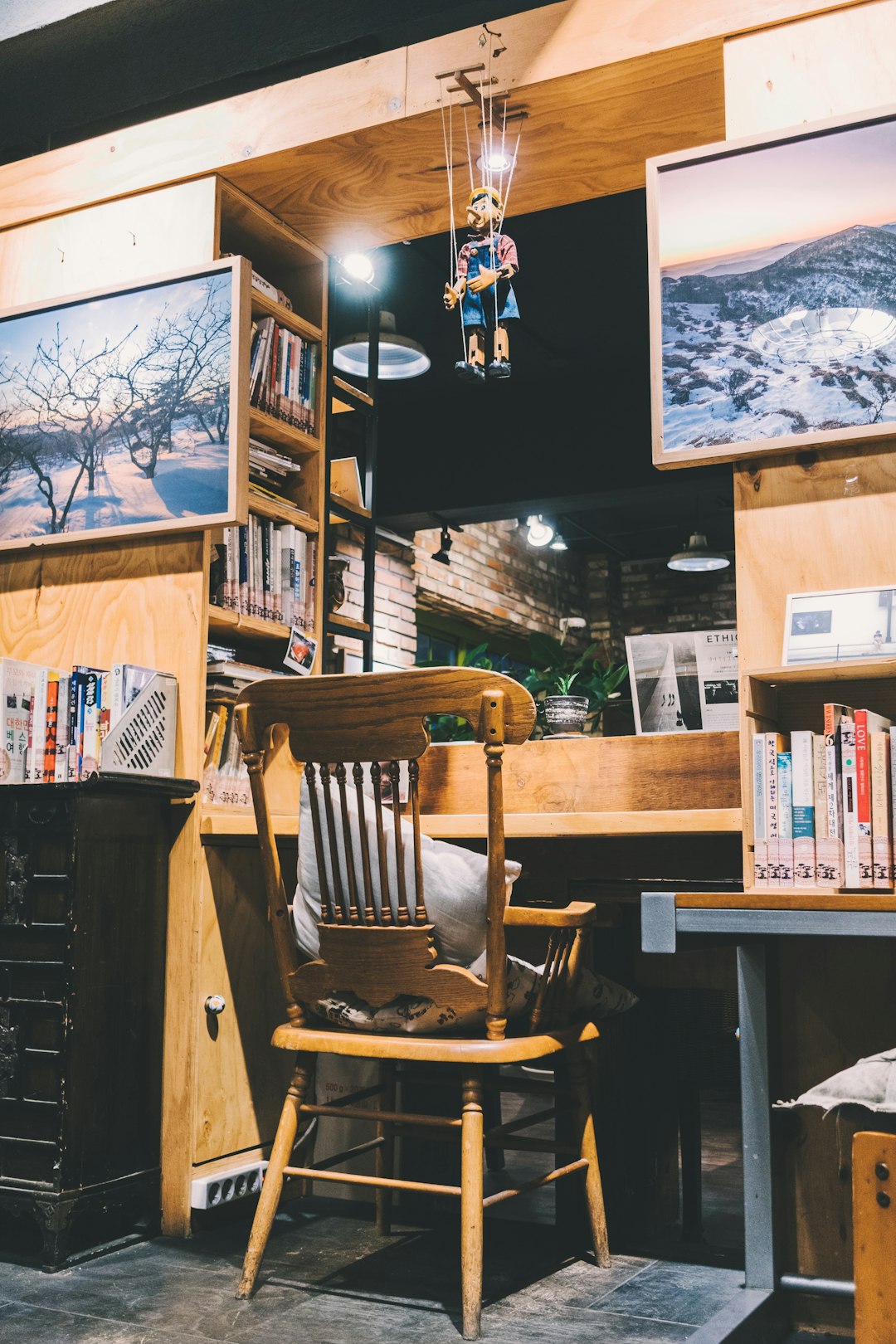 brown wooden chair in front of brown desk in well-lit room