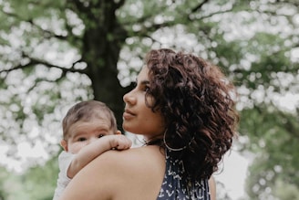 woman carrying baby