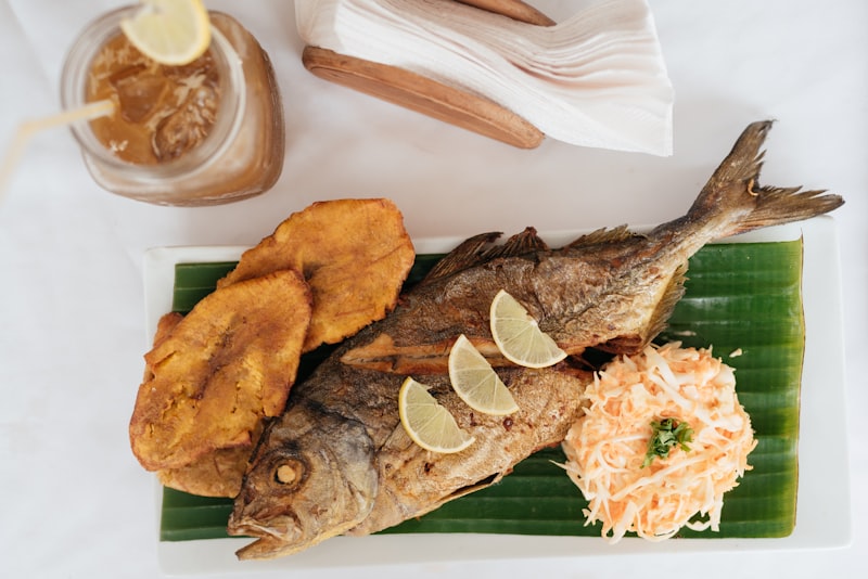Golden fried fish served with slices of lemon