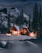 A cozy cabin nestled among snow-dusted pine trees in Aspen at twilight.