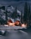 Cozy mountain cabin with a glowing pellet stove burning warmly inside during a snowy evening.