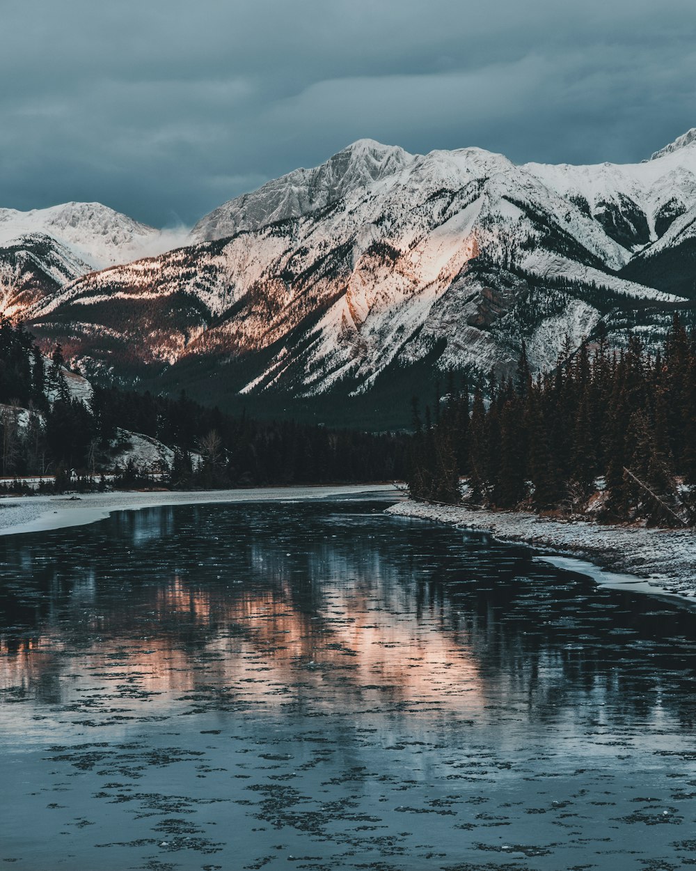 black mountain near body of water