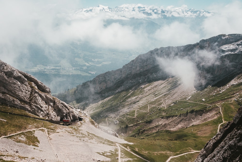 mountains under cloudy sky during daytime