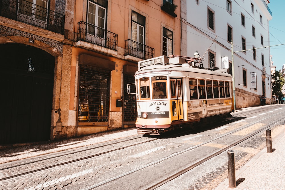 white tram running on the city
