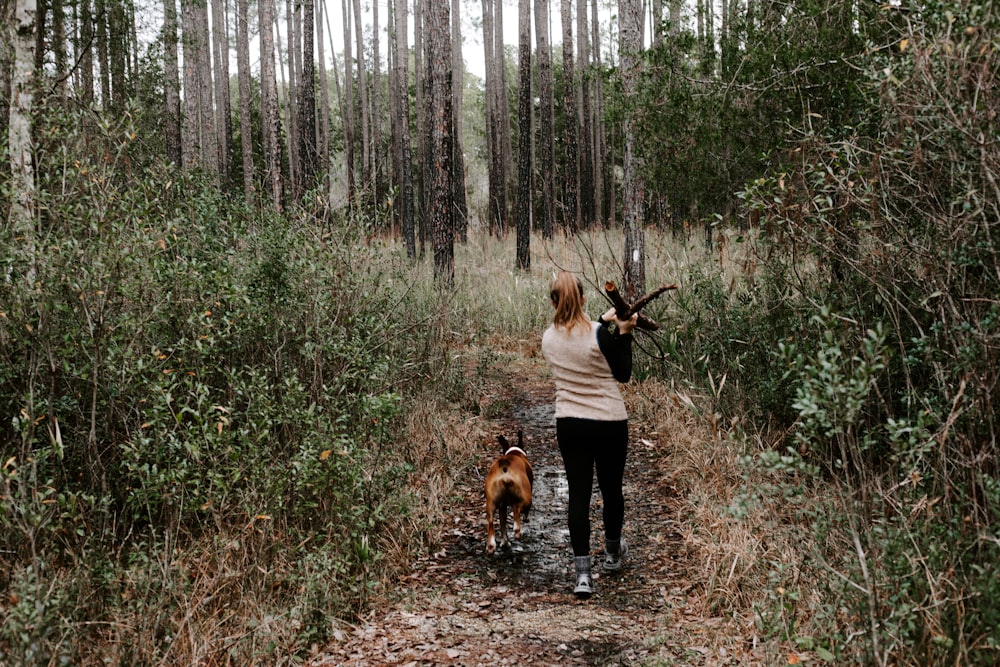 woman carrying tree branch