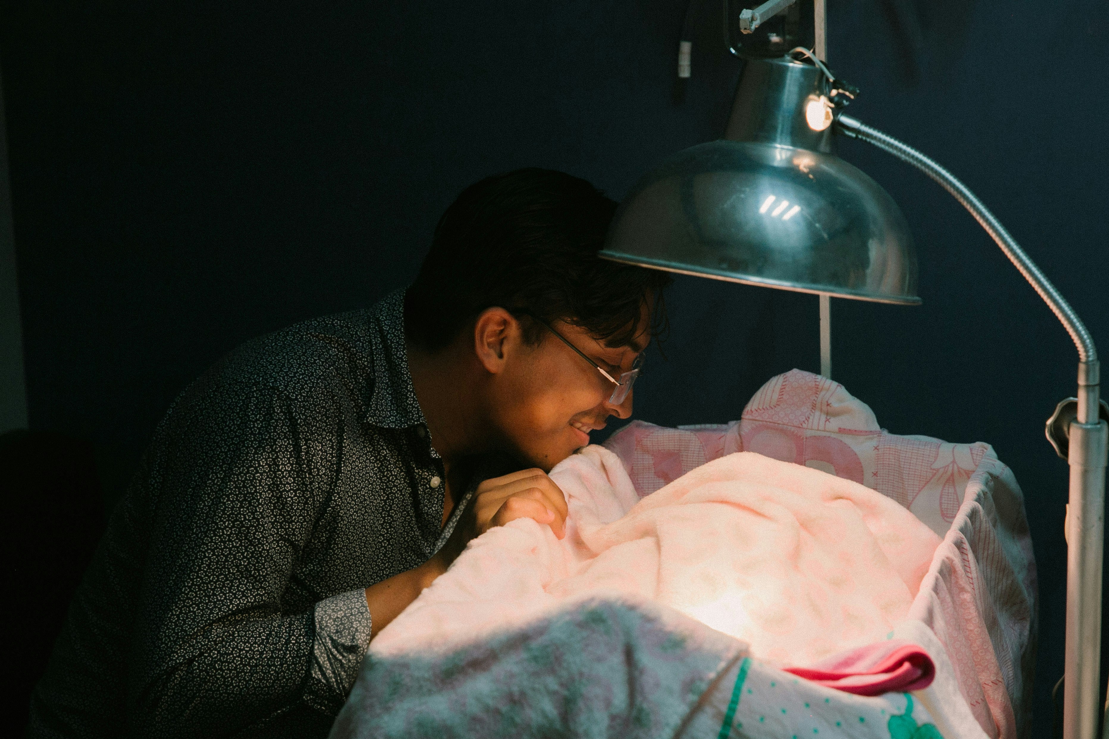 He is my best friend and I took this picture the day his daughter was born. I saw him mesmerized with his daughter and I took the picture.