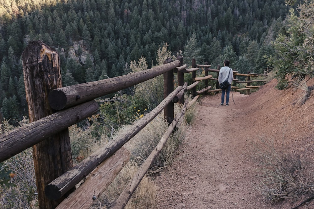 man walking on pathway during daytime