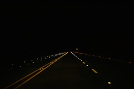 black concrete road during nighttime