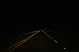 black concrete road during nighttime