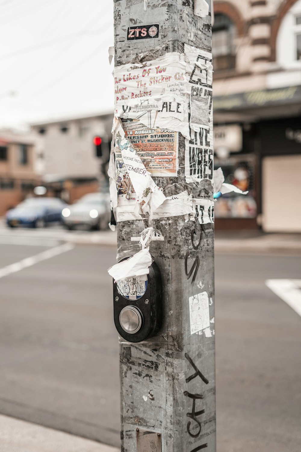 gray concrete post beside road