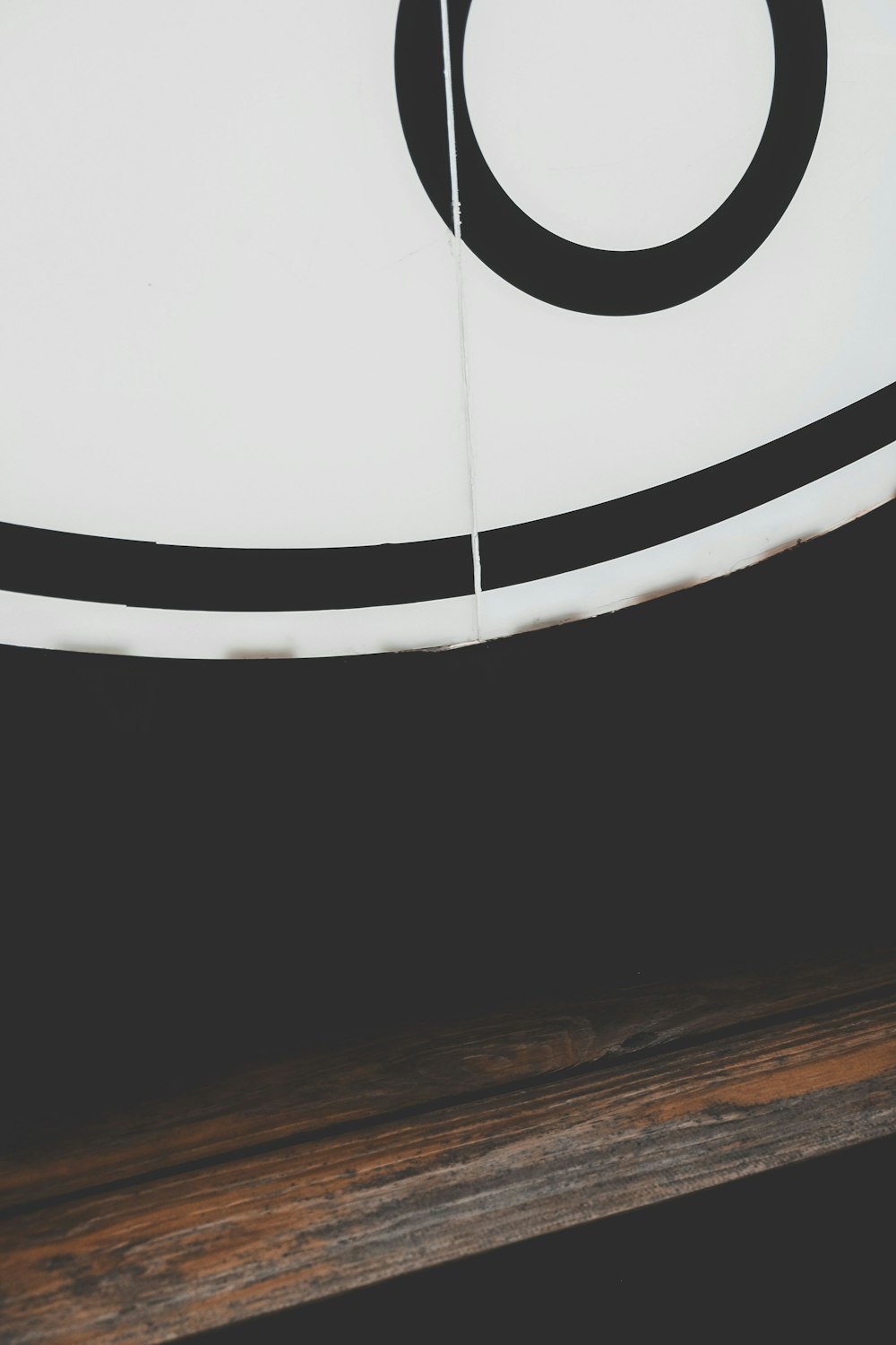 a close up of a surfboard on a wooden surface