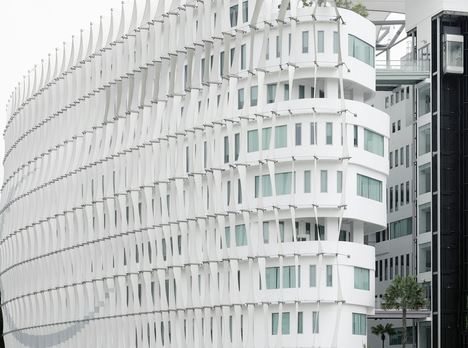 Fujifilm X-T1 + Fujifilm XC 50-230mm F4.5-6.7 OIS sample photo. White concrete high-rise building photography