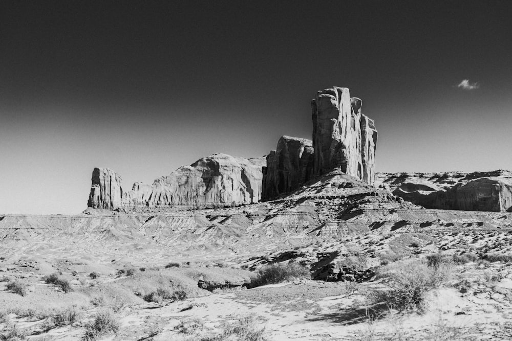 grayscale photo of rock formation