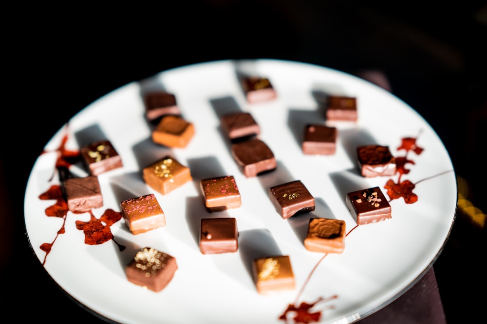 cube chocolates on round white ceramic plate