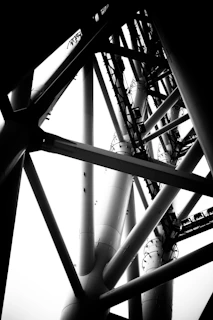 Minimalistic structural steel framework captured from below, emphasizing geometry.