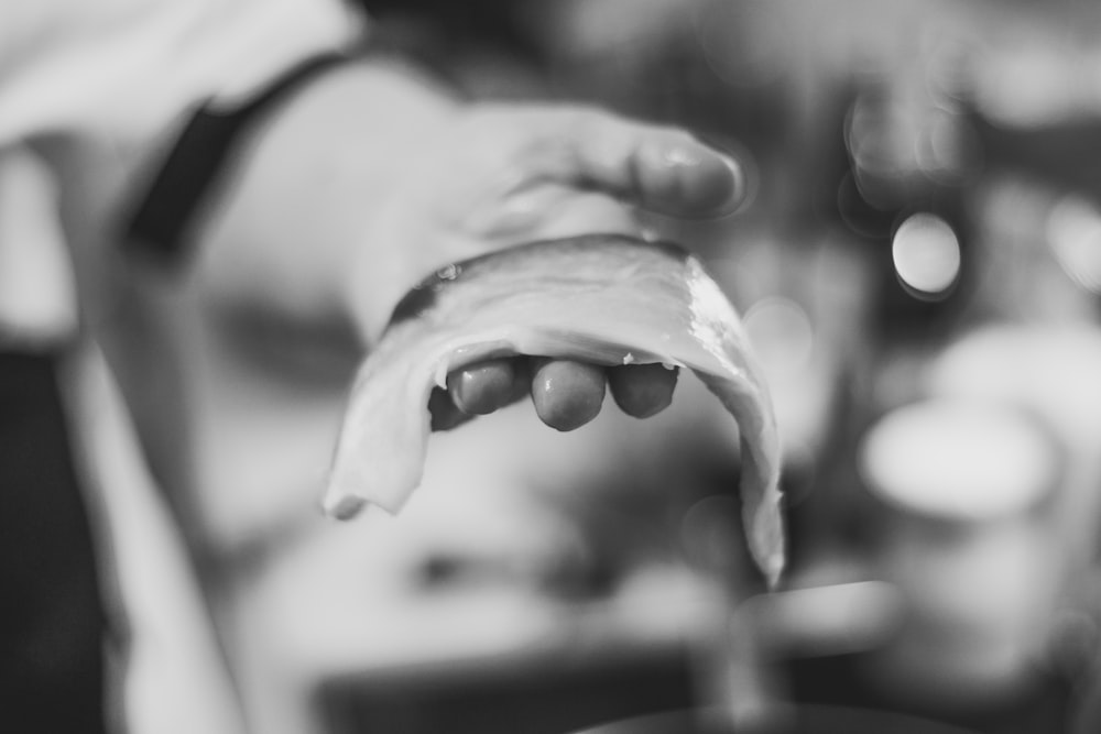 person holding fish meat