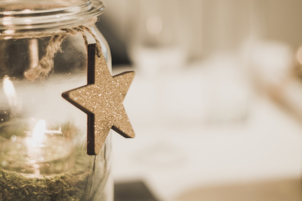 close-up photography of star hanging on bottle