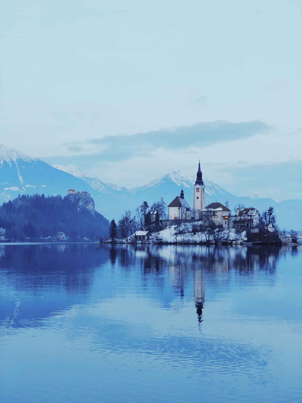 white and black building in the middle of body of water