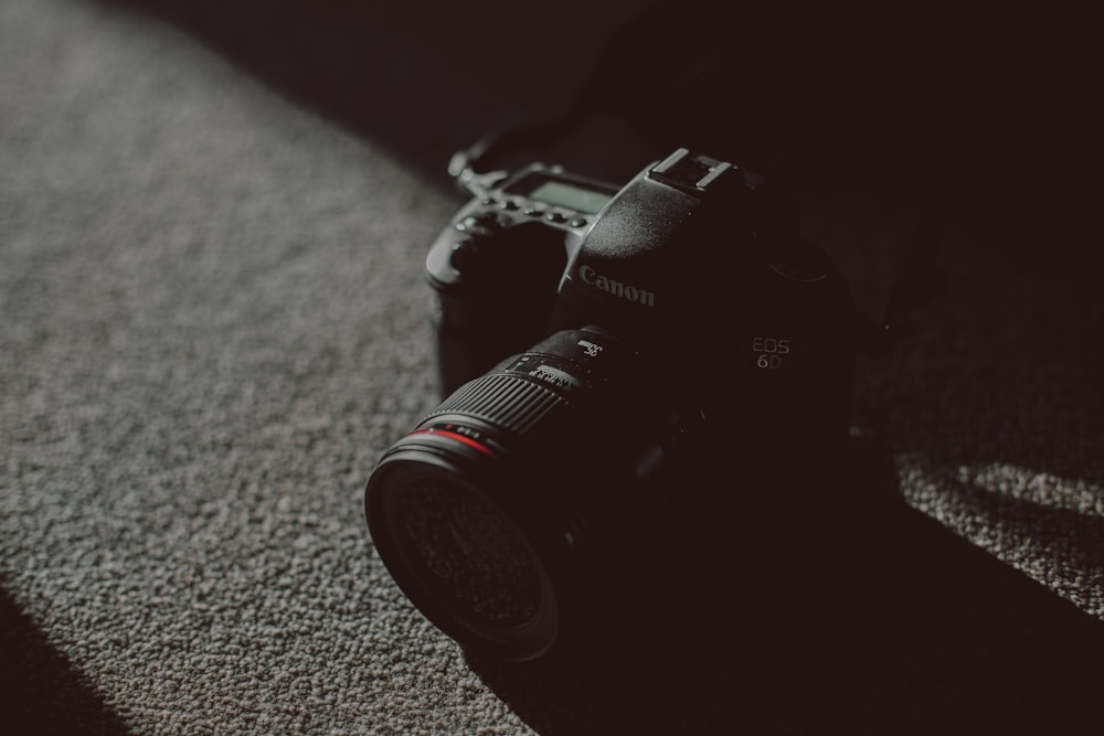 black Canon EOS 6D on gray textile