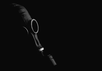 SCBA mask cover being easily attached to a mask lens, highlighting its secure fit.