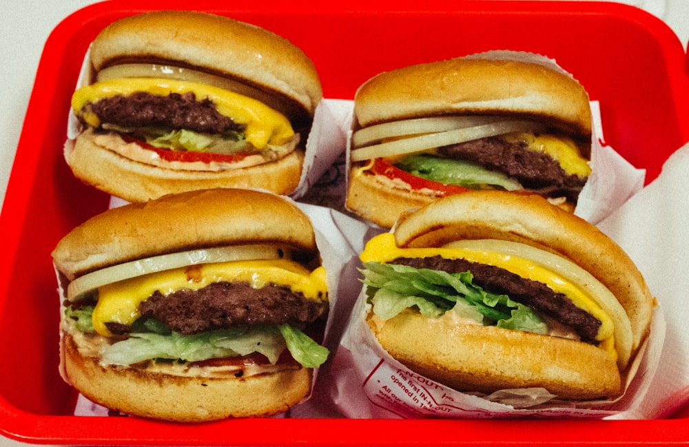 four burgers with patties on basket photo – Free Burger Image on Unsplash