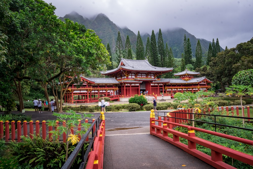 red concrete temple surrounded by trees during daytime