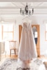 hanged white lace sleeveless wedding dress