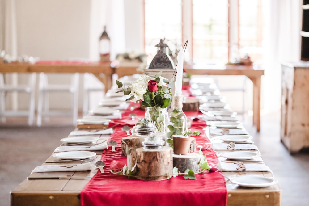 long table with plates and spoon set up