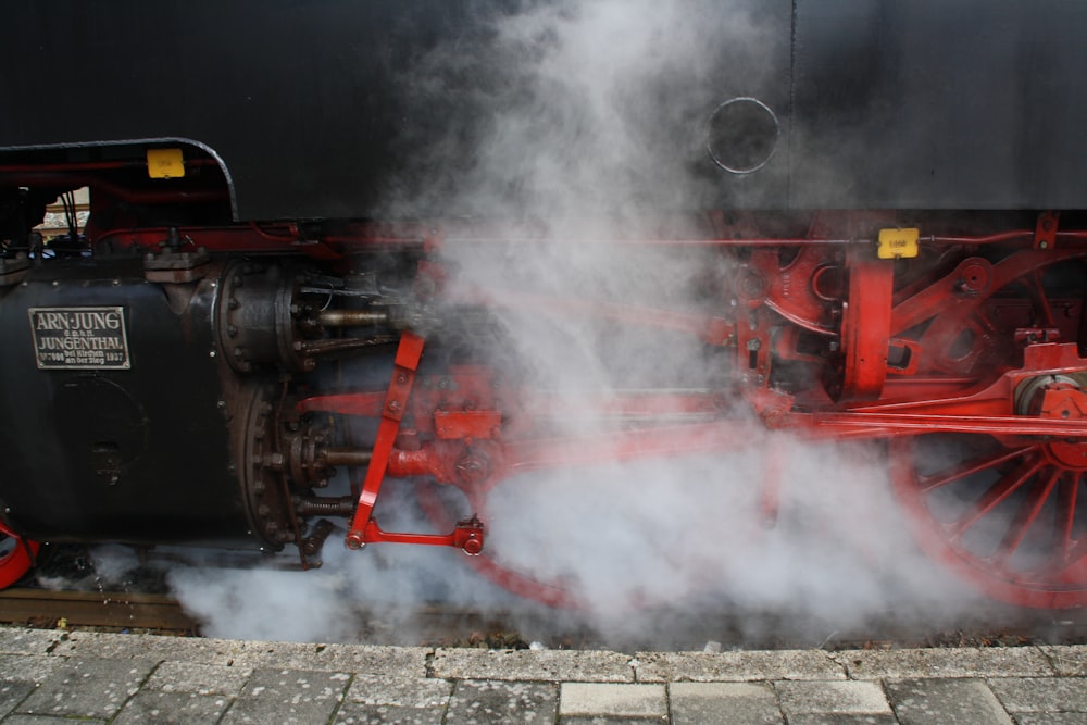 smoking black and orange train