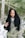 woman surrounded by snow under green trees