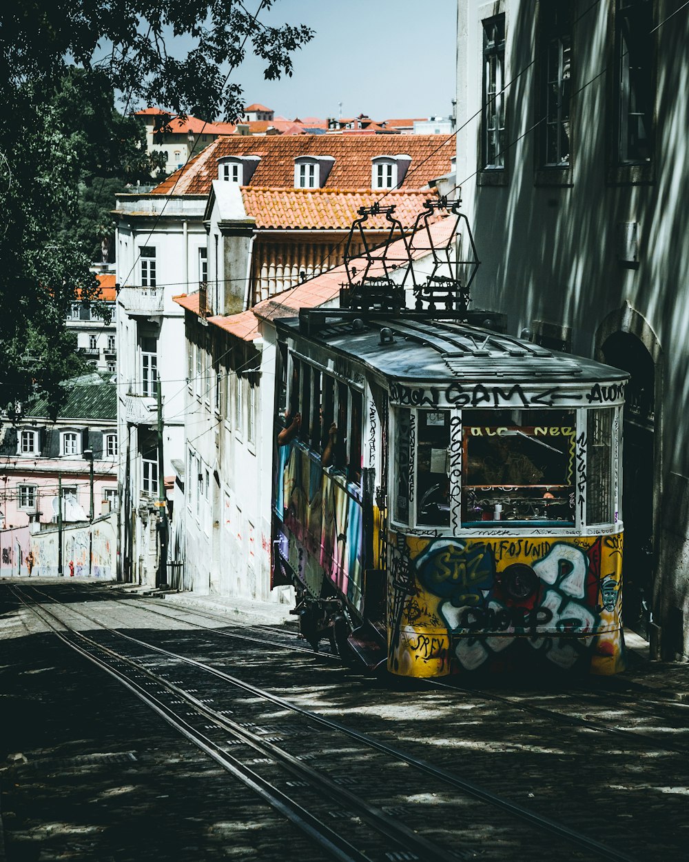 yellow and multicolored tram at daytime