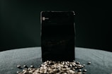 A close-up of a product with a dark overlay and dramatic shadows.