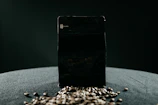 Minimalist shot of elegant coffee seed packaging with subtle shadows.