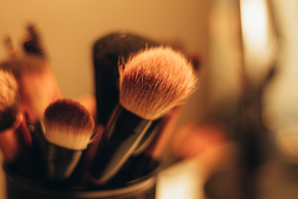 makeup brushes on black organizer