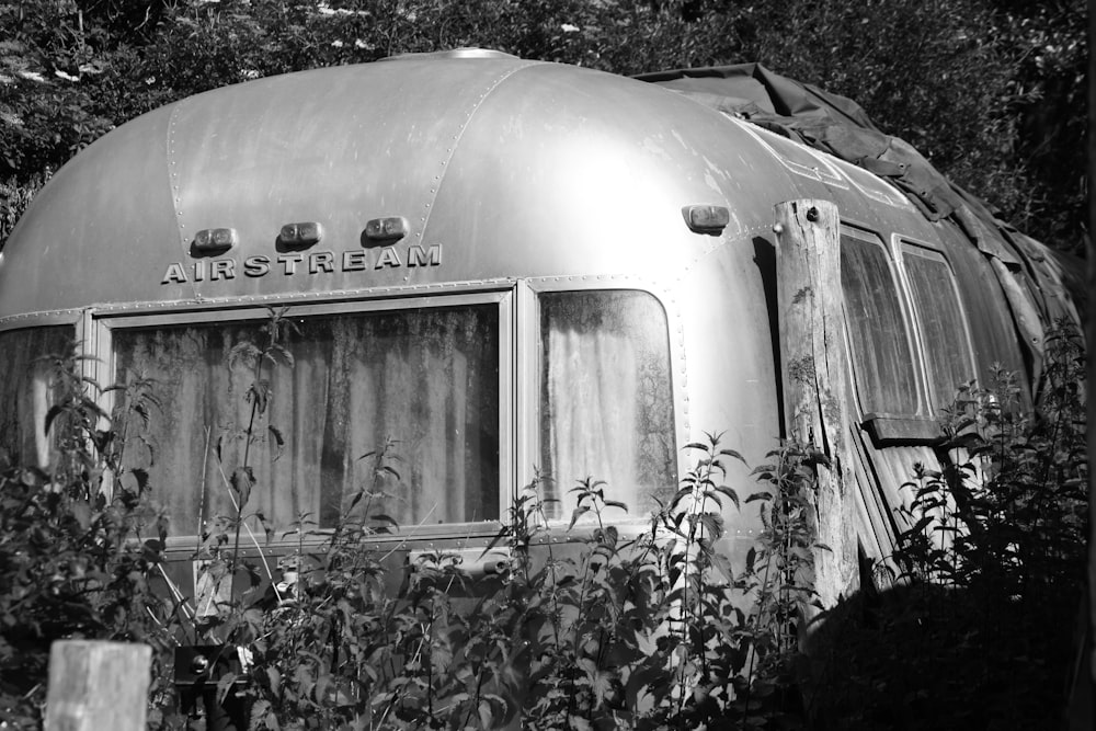 grayscale photography of airstream camper trailer