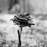 A close-up of an exquisite, handmade rose sculpture.