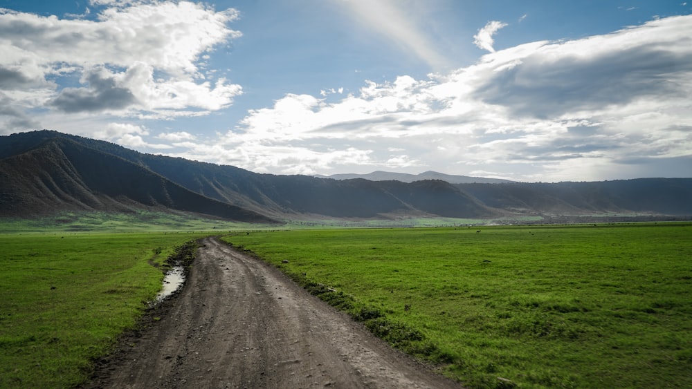 empty road under blue and white sky