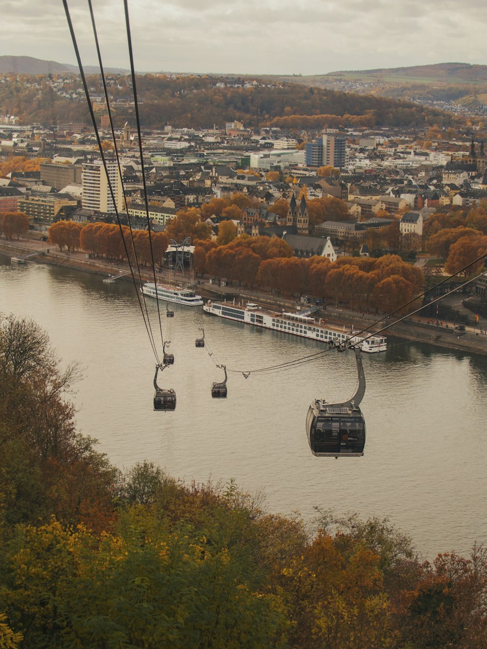 low angle photography of grey cable cars during daytime