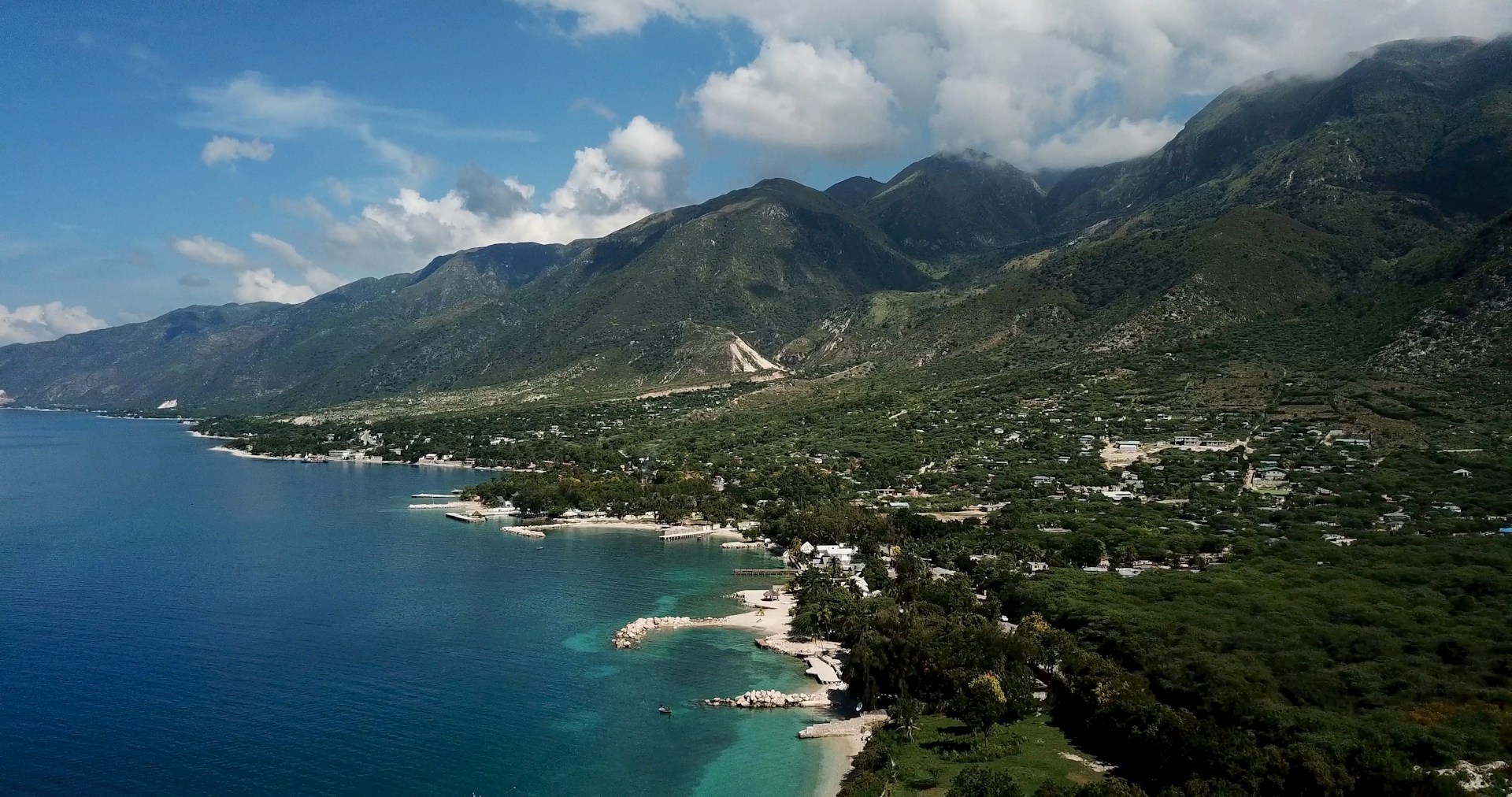 town at the foot of mountain by the sea