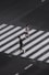 aerial photography of man and woman walking on pedestrian lane during daytime