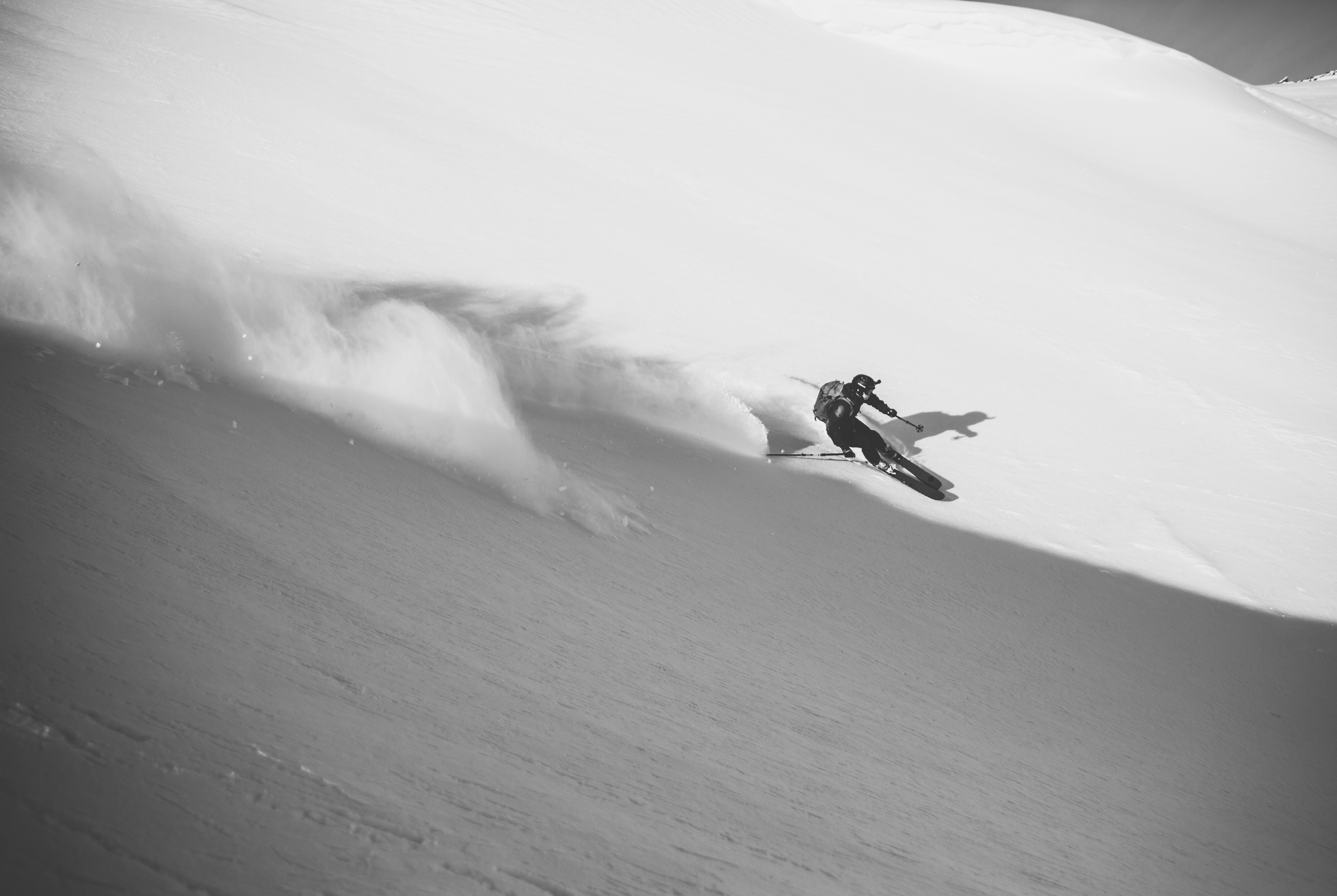 Black and white action shot of a skier