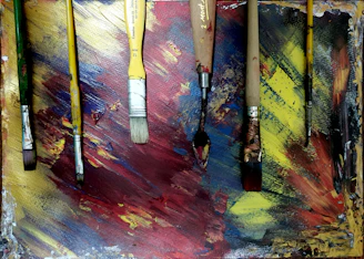 assorted-colored paint brushes