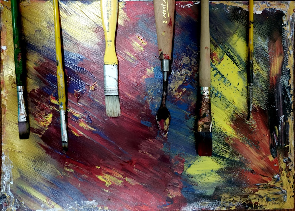 assorted-colored paint brushes