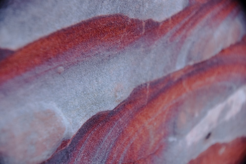 a close up of a red and white object