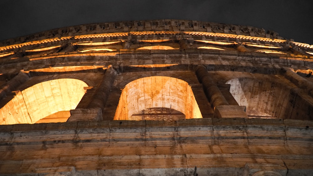 low-angle photo of lighted colloseum