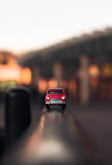 shallow focus photography of red die-cast car