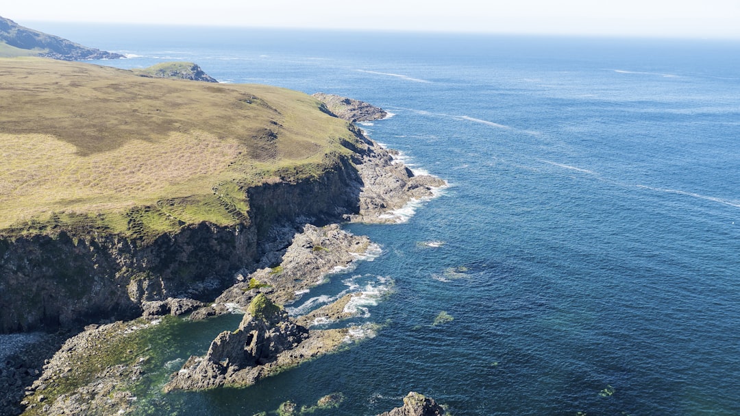 beach cliff viewing calm sea,