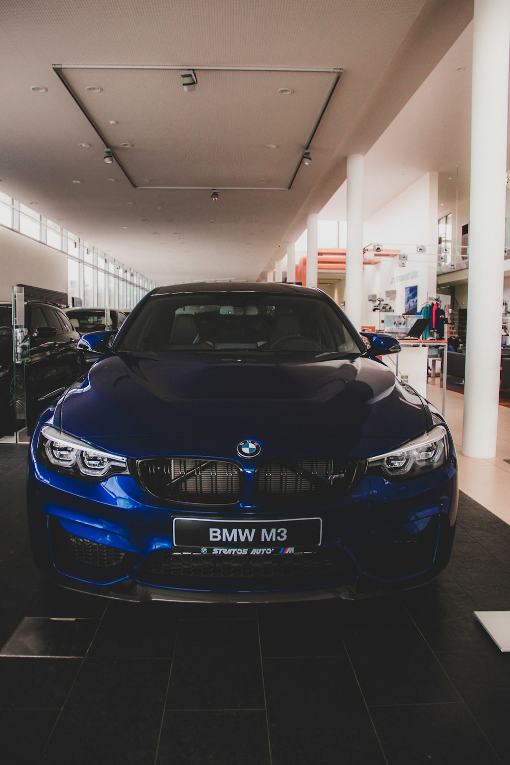 blue BMW vehicle inside building