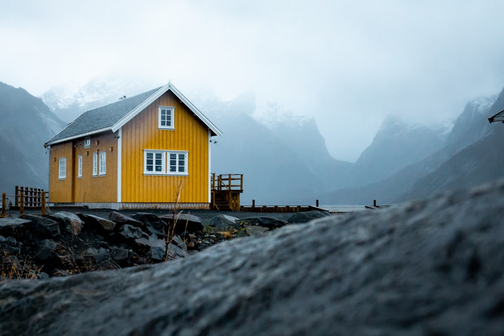 yellow house under whiet sky